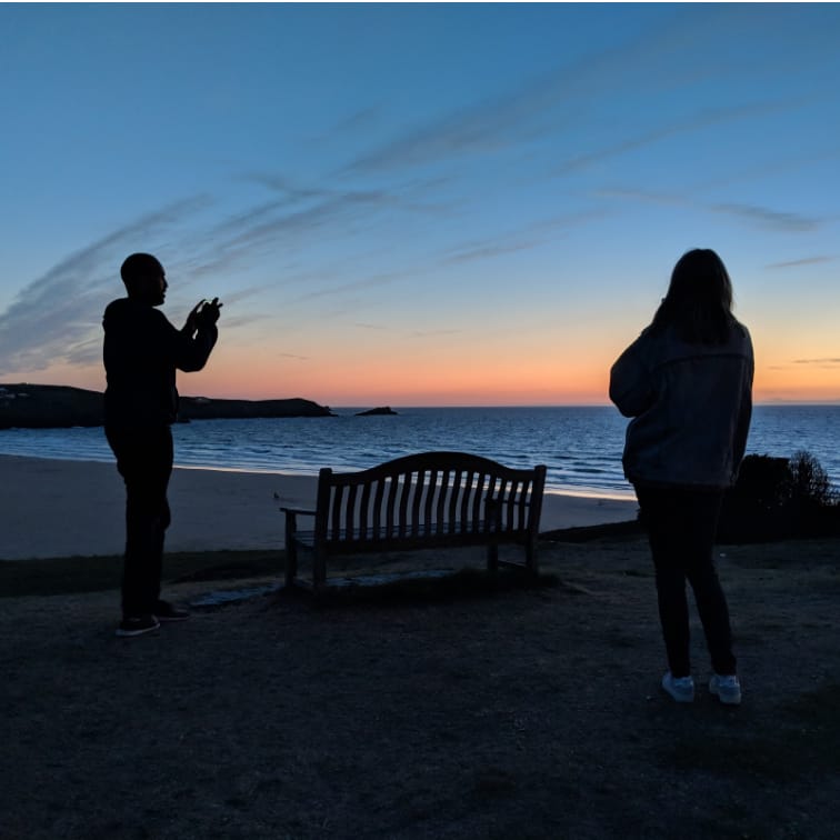 A photo of Tim taking a photo of a sunset in Cornwall. Photoception.